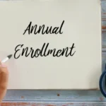 Notebook with "Annual Enrollment" and stethoscope.